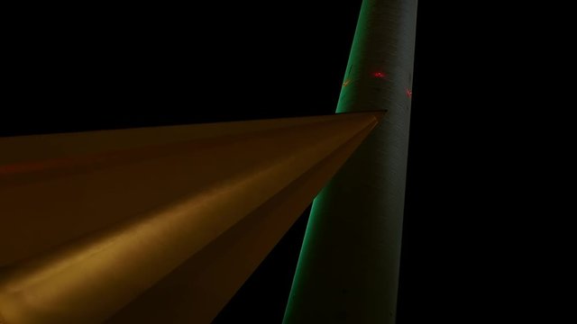 Berlin TV Tower Pillar with Lightshow, Berlin TV Tower Fernsehturm at Night, Light Projection Festival of Lights. Detail tower and roof element of the base with colorful, red, pink and blue lightshow.