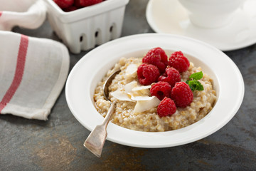 Steel cut oatmeal porridge with raspberry and coconut