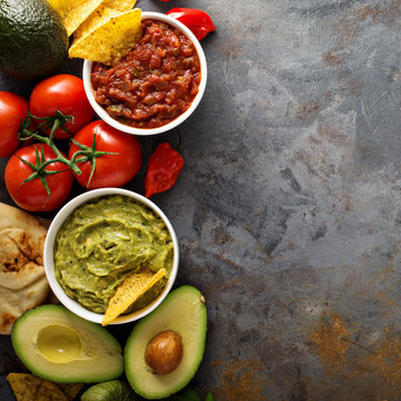 Homemade hummus, salsa and guacamole with corn chips