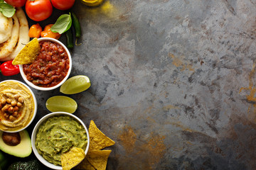 Homemade hummus, salsa and guacamole with corn chips