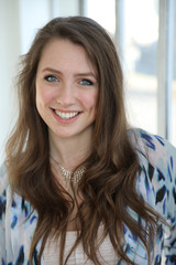 Woman with Brown Hair and Beautiful Blue Eyes