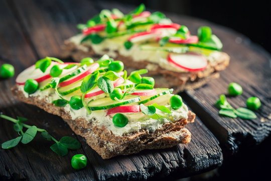Spring sandwich with fromage cheese, avocado and crunchy bread