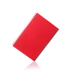 New red note book. Studio shot isolated on white