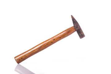Old steel hammer with wood handle. Studio shot isolated on white