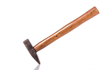 Old steel hammer with wood handle. Studio shot isolated on white