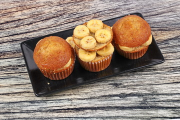 Homemade banana cakes topped sliced banana.