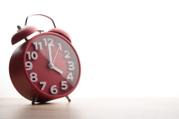 Red alarm clock isolated on white background. Business time.