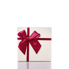 New color gift box with ribbon. Studio shot isolated on white