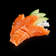 traditional fresh japanese sashimi on a black background