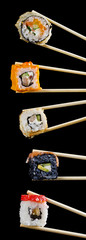 traditional fresh japanese sushi rolls on a black background