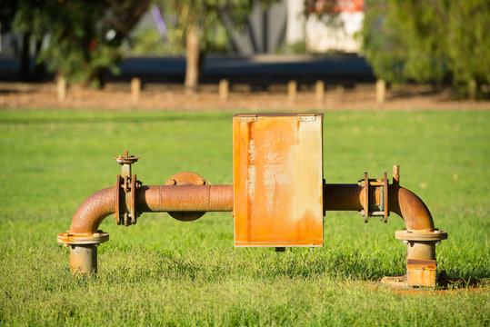 Rusty power supply pump pipeline in park