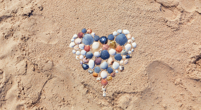Heart made of seashells on the beach