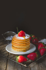 Breakfast Time with Fresh Strawberry on Stack of Pancake Pouring