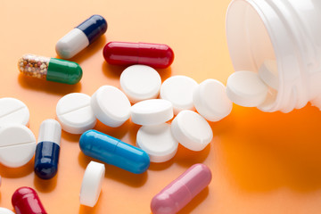 Different multicolored pills and medicine capsules