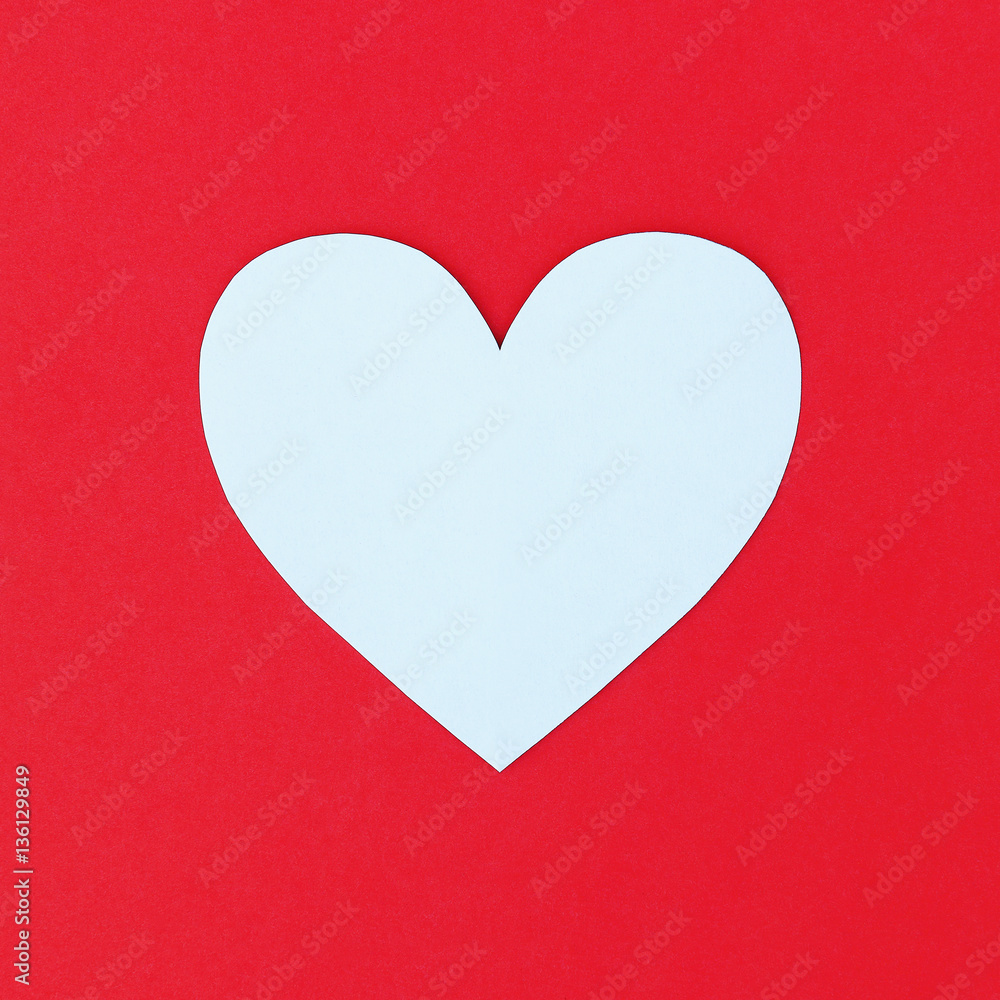 Poster design of cutting white paper heart on red paper background
