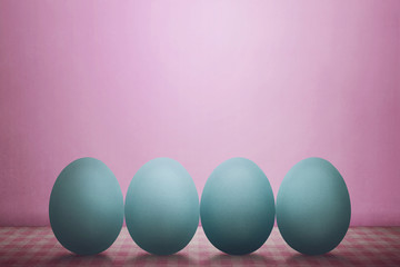 Row of easter eggs on desk