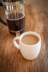 white cups and coffee plunger