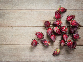 Hibiscus sabdariffa or roselle fruits on old wooden background