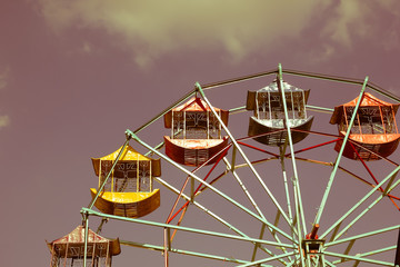 Old Vintage Ferris wheel over blue sky