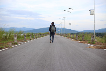 Man walking on road in Rayong, Thailand