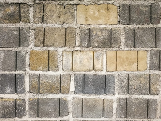Close up old concrete block wall with gray background of cement brick wall. Surface and texture rough wall of abandoned home.