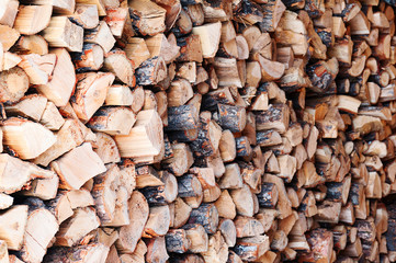 Woodpile from dry oak logs. Selective focus.