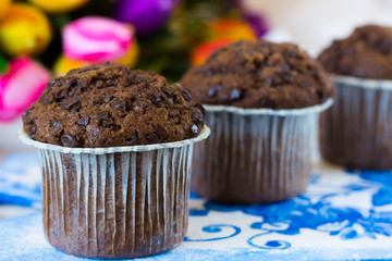 Three chocolate muffins