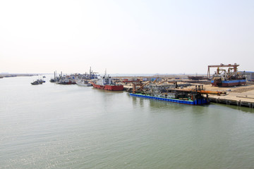 busy shipyard dock and docked ships