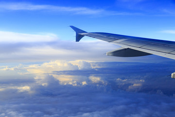 Fototapeta na wymiar Skyline View above the Clouds from air plane