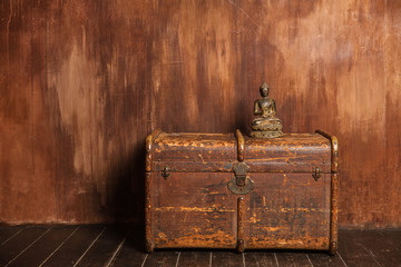 Vintage dower chest box Buddha Concept on Shabby Background old metal texture