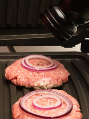 meat on the stove rattling off the the seasoning out of the mill