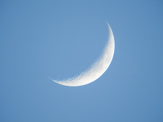 Obraz na płótnie Canvas Crescent moon in the morning with clear blue sky
