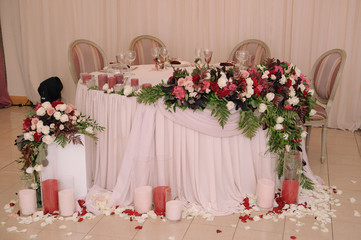 Wedding table decorated with bouquet and candles