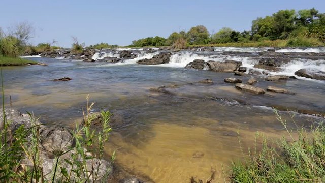 Famous Popa water falls on river in Caprivi strip region, North Namibia, Africa wilderness landscape
