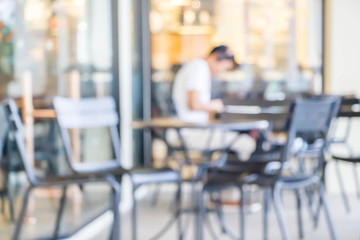 blurred people in coffee shop