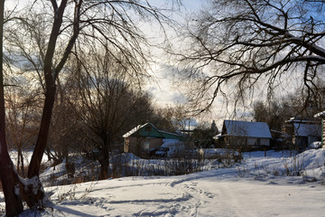 beautiful rural winter landscape: houses, trees, snow, river, nature 