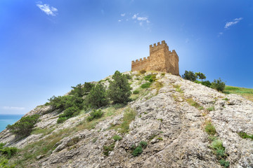 Fototapeta na wymiar Genoese fortress view from below, the bright daytime photo fortr