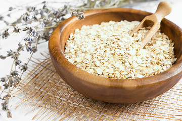 Rolled oats, porridge and cranberries for a healthy breakfast in a rustic style