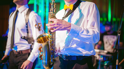 musician plays the saxophone performance at a concert