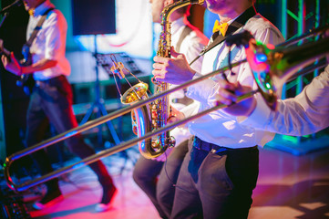 musician plays the saxophone performance at a concert - obrazy, fototapety, plakaty