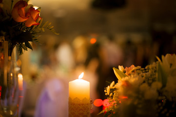 kindled flame of a candle on a blurred background