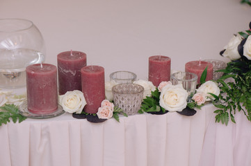 A little shelf, decorated with petals and candles