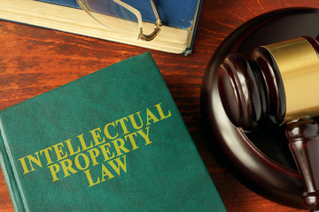Book with title intellectual property law on a table.