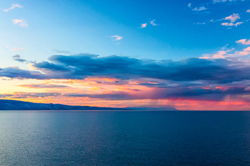 Fototapeta na wymiar Sunset over a mountain ridge at Lake Baikal