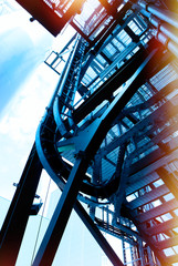 Naklejka premium Industrial zone, Steel pipelines and cables in blue tones