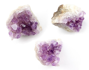 Transparent crystals of amethyst on white background, shot close