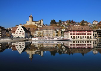 Obraz premium Medieval castle Munot and old houses reflecting in the river Rhine