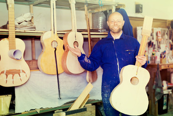 Fototapeta premium Guitar-maker at workshop