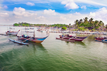 Fototapeta na wymiar Catamaran-boats on a water near the shore