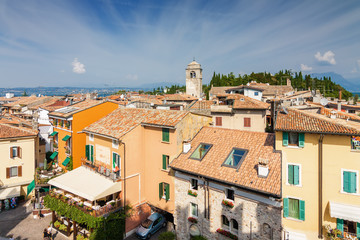 Obraz premium Sunny view of town from viewpoint of Rocca di Sirmione at Garda lake, Lombardia region, Italy.